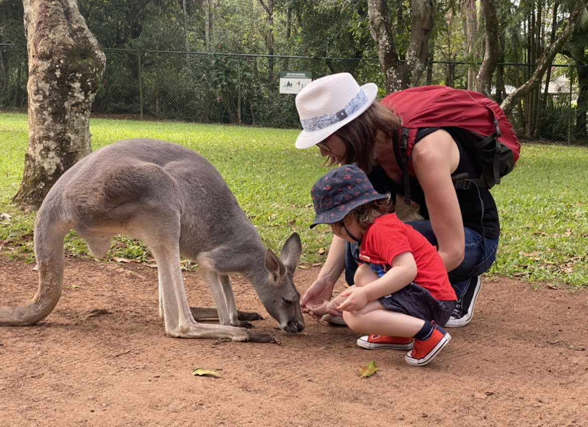 Emma Codd and son feeding a kangaroo